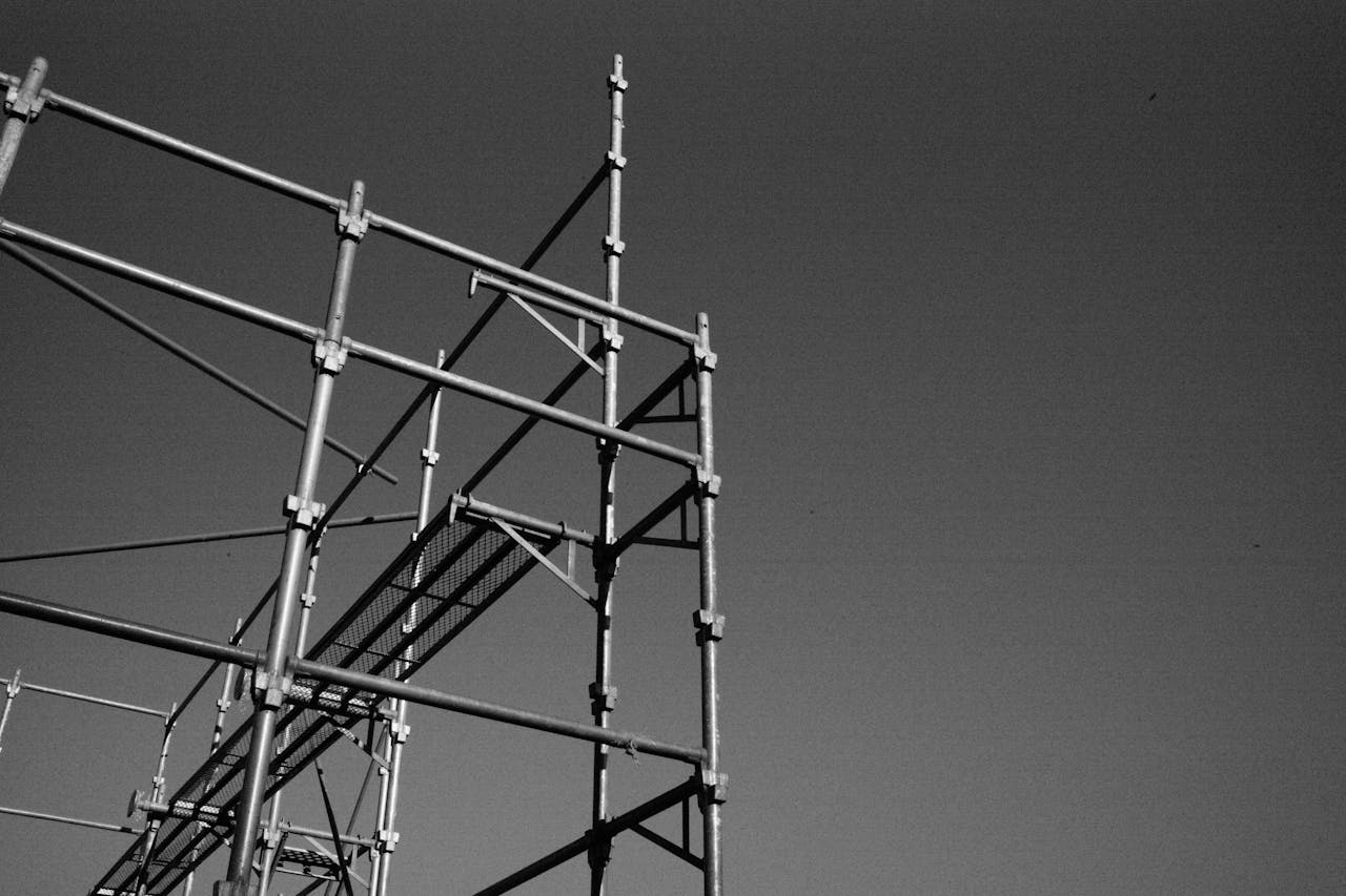 Low angle view of a metal scaffolding structure against a clear sky.